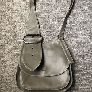 Matt and nat crossbody purse with large buckle.